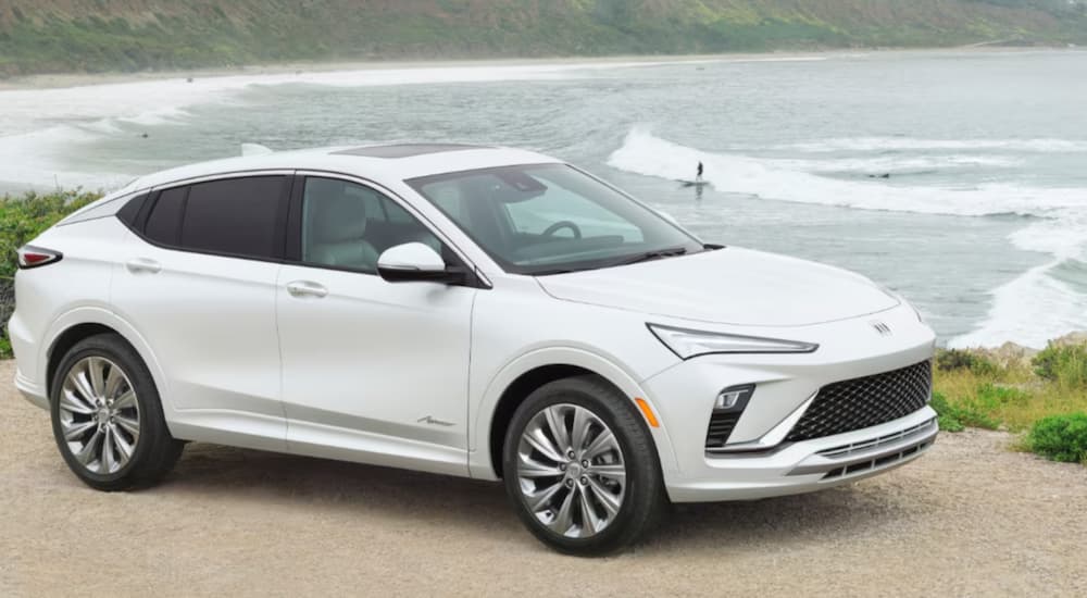 A white 2024 Buick Envista Avenir parked overlooking the ocean.