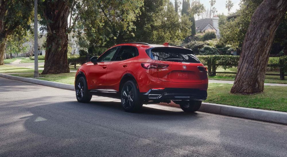 Rear view of a 2026 Buick Envision ST parked on a residential street.