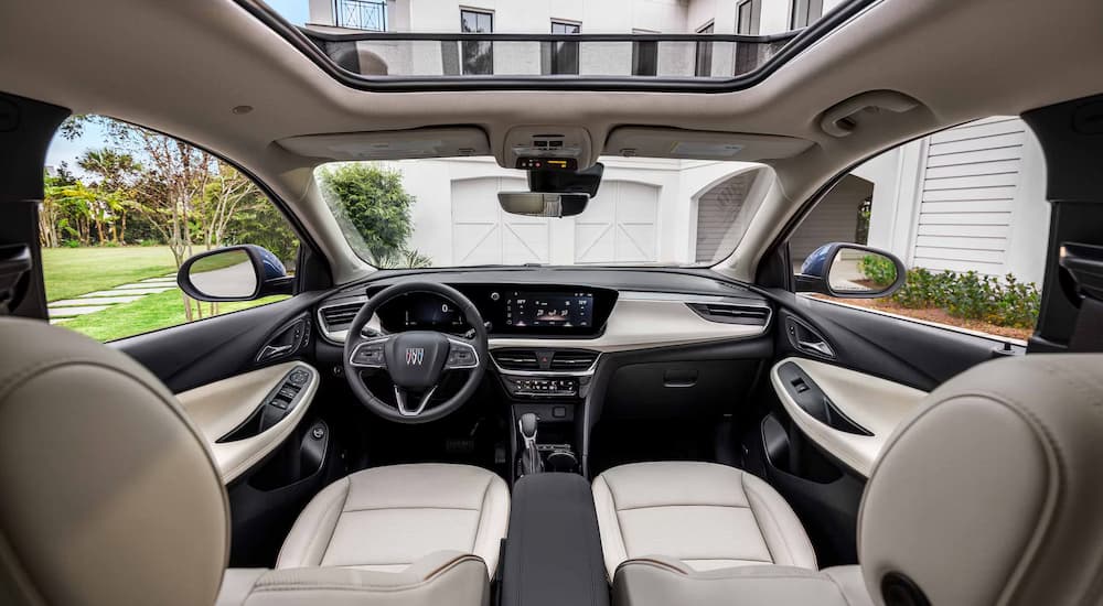 The black and tan interior cabin of a 2025 Buick Encore GX.