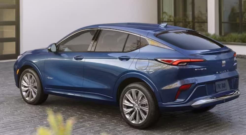 A blue 2024 Buick Envista is shown parked on a driveway.