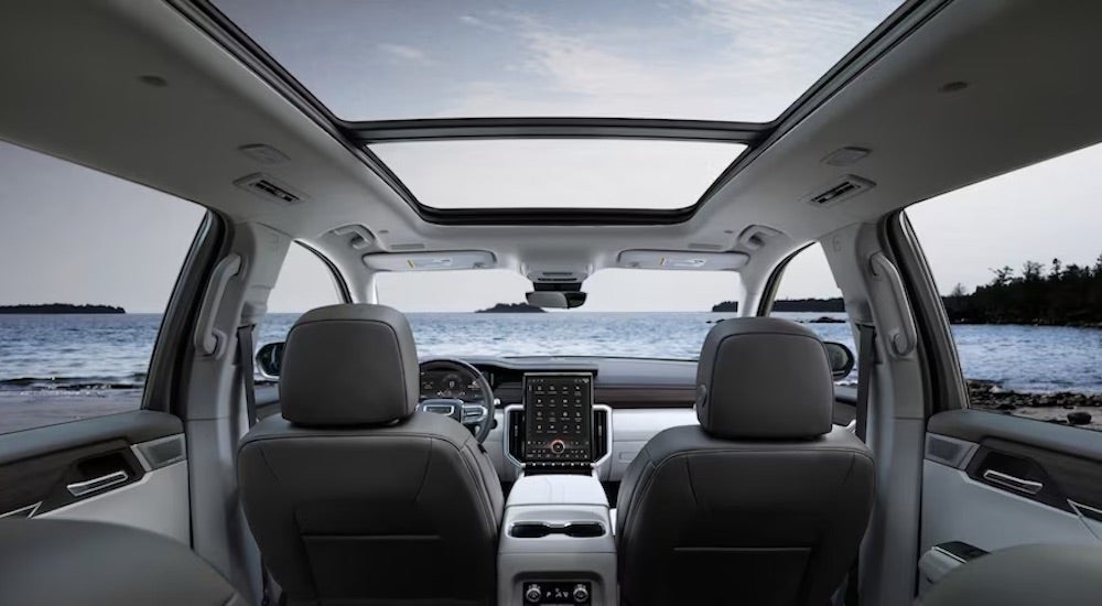 The grey interior of a 2024 GMC Acadia Denali is shown.