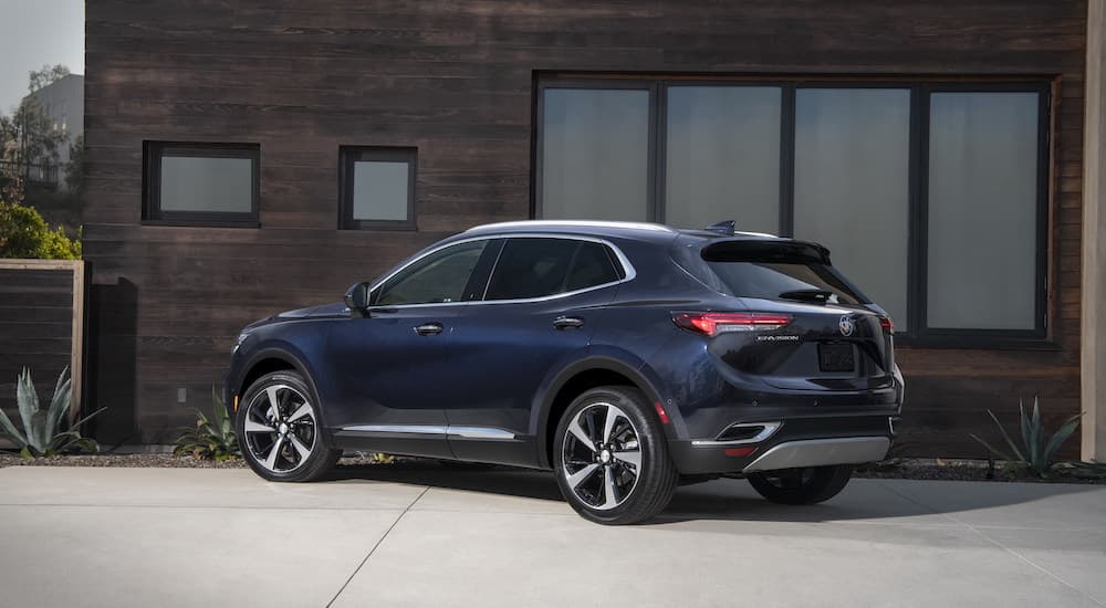 The blue interior of a 2025 Buick Envision is shown from the rear at an angle.