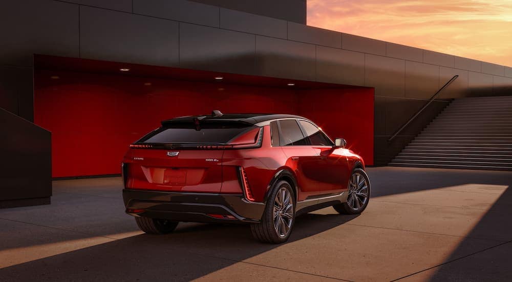 A red 2024 Cadillac LYRIQ for sale is shown from the rear at an angle.