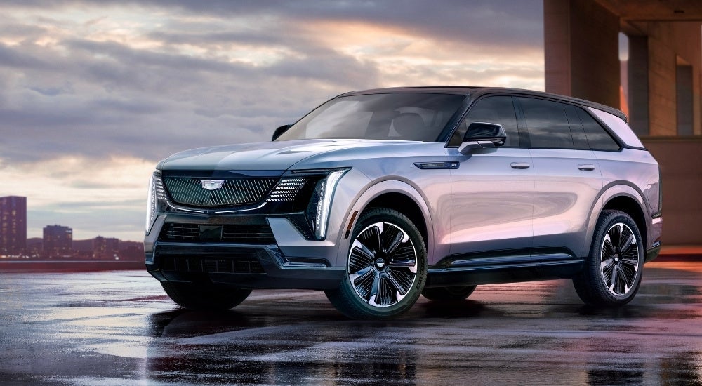 A silver 2025 Cadillac Escalade IQ is shown from the front at an angle.