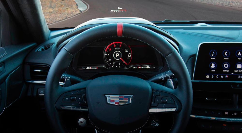 Close up of the steering wheel and HUD on a 2026 Cadillac CT4-V.