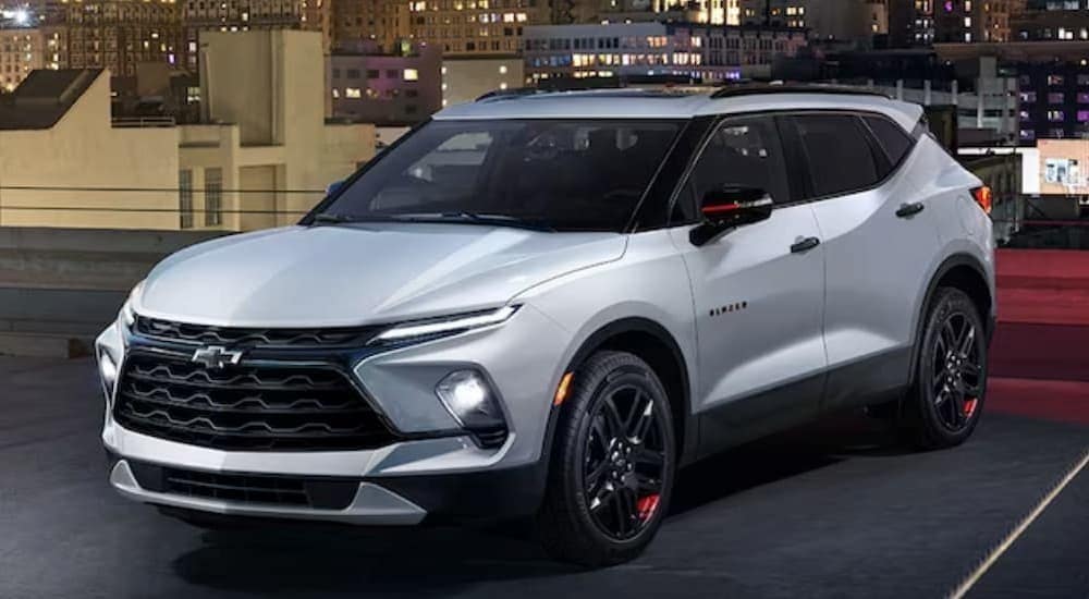 A close-up of the front end of a red 2024 Chevy Blazer RS is shown.