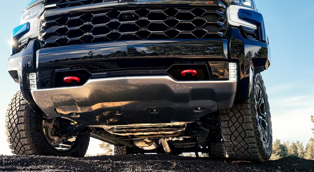 A blue 2025 Chevy Silverado 1500 ZR2 parked off-road.