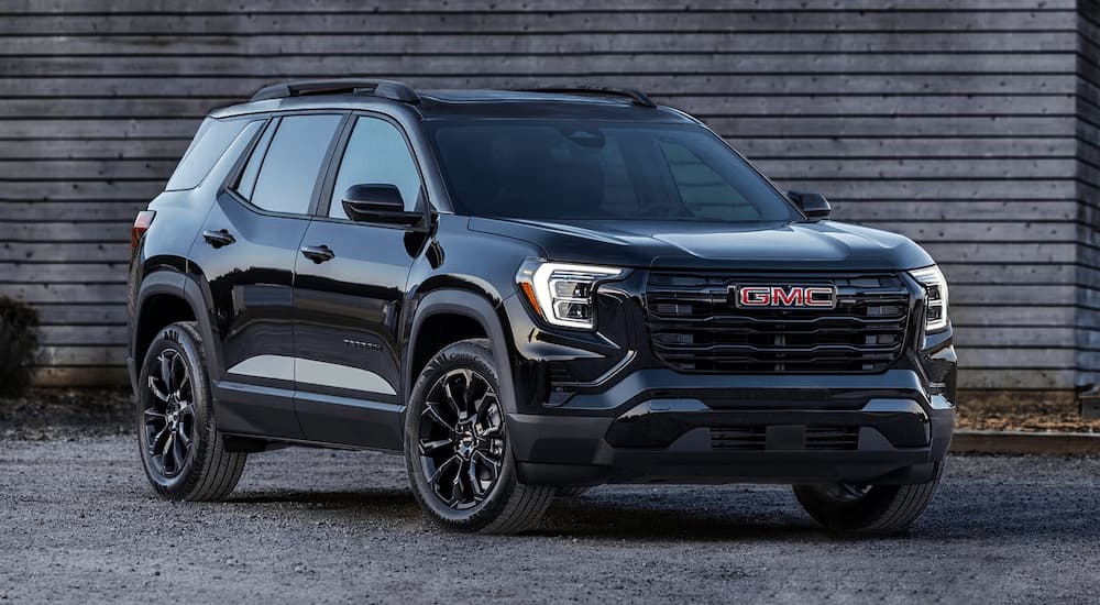 Black 2025 GMC Terrain for sale parked near a wall.