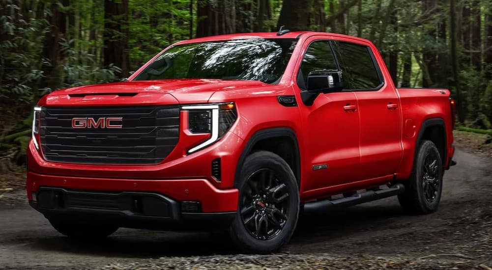 A red 2026 GMC Canyon Elevation parked off-road.