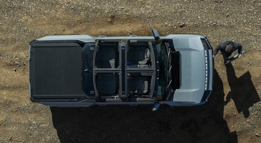 Aerial view of the infinity roof on a blue 2025 GMC Hummer EV Pickup.