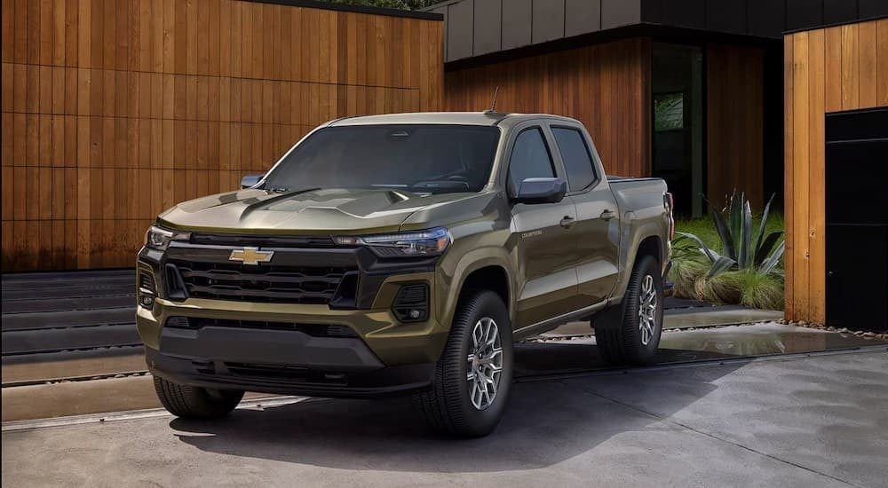 A green 2026 Chevy Colorado LT parked near a Chevy dealer.