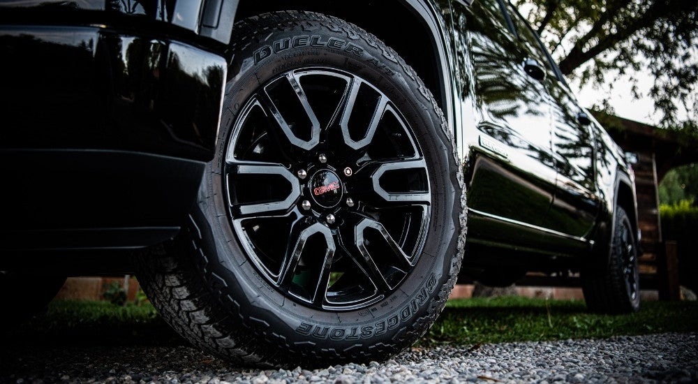 The wheel of a 2025 GMC Sierra 1500 for sale.