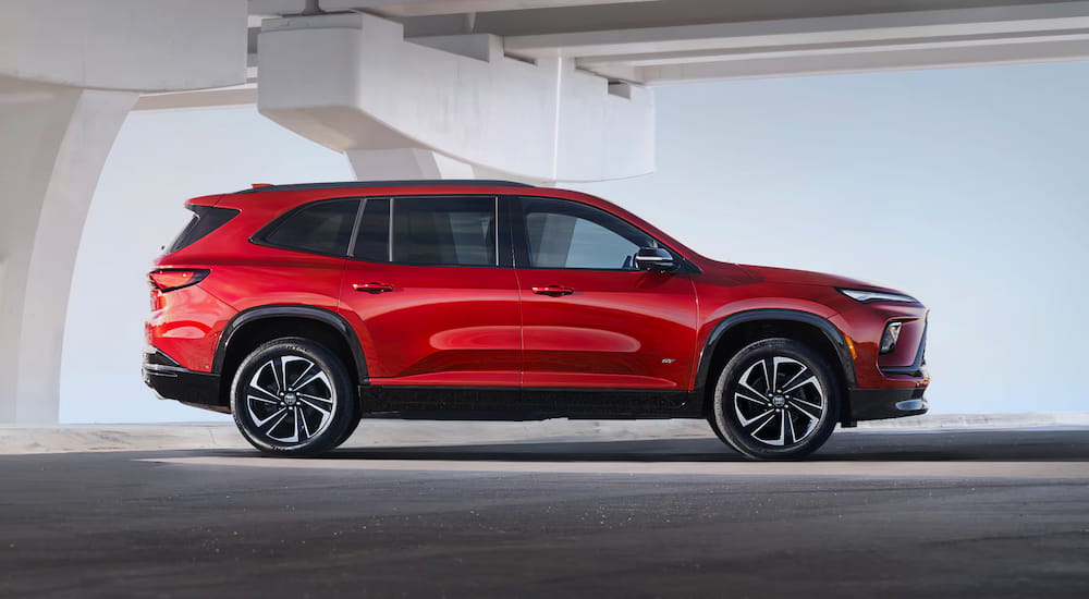 A side angle view of a red 2025 Buick Enclave.