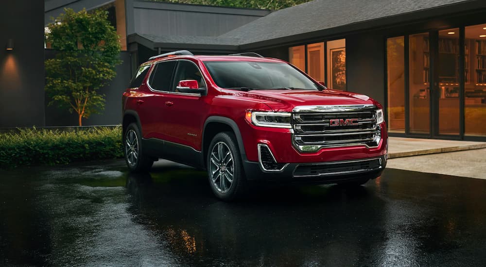 Red used 2020 GMC Acadia for sale parked on a driveway.