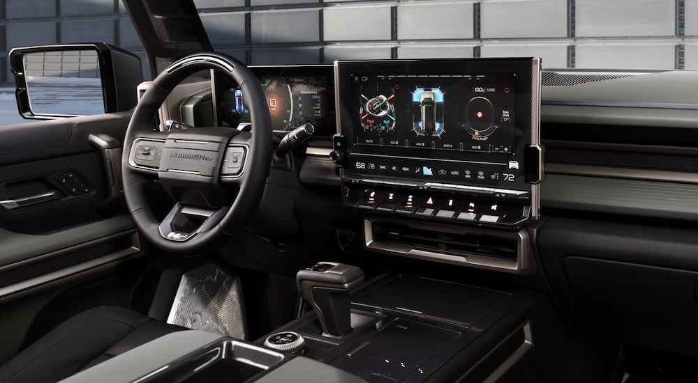 The black interior of a 2024 GMC Hummer EV SUV.