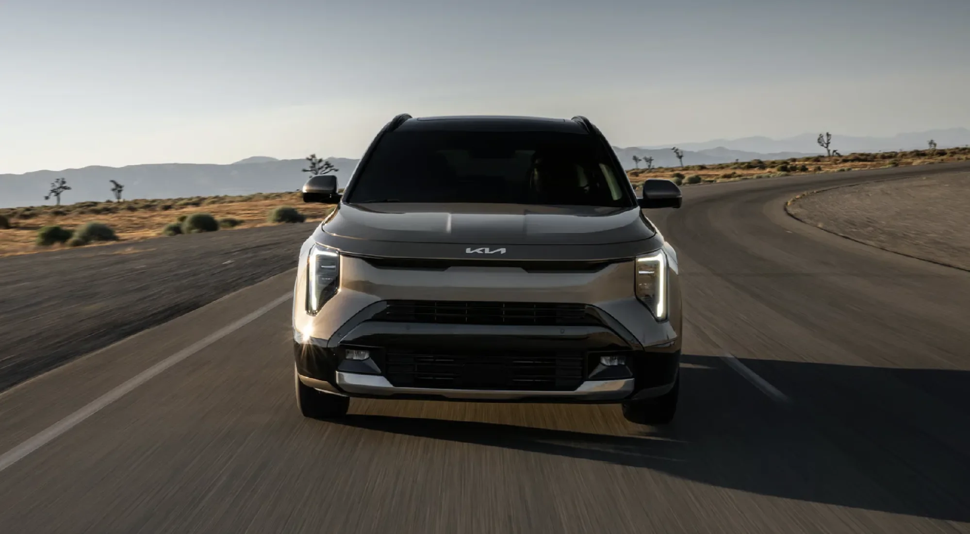 Wide LED projector headlights and fog lights shown on the 2027 Niro SX Touring