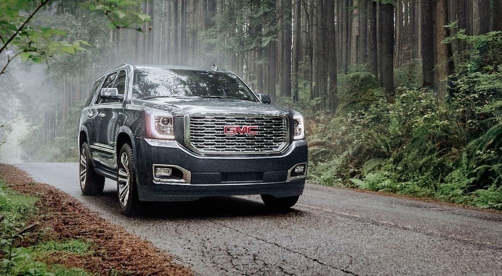 A grey 2021 GMC Yukon is shown from the front after leaving a used car dealership near Dayton.