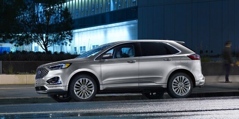 A grey 2024 Ford Edge parked on the street.