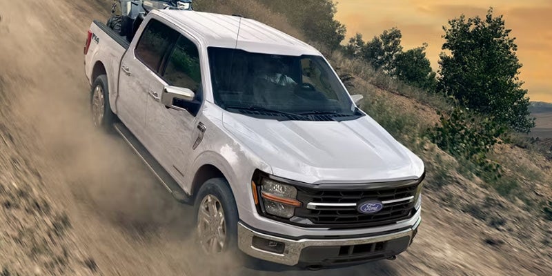 White Ford F-150 in sunset
