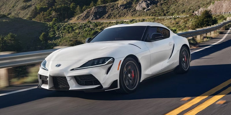 A 2025 Toyota GR Supra zooming down a highway in Pleasant Hills, PA