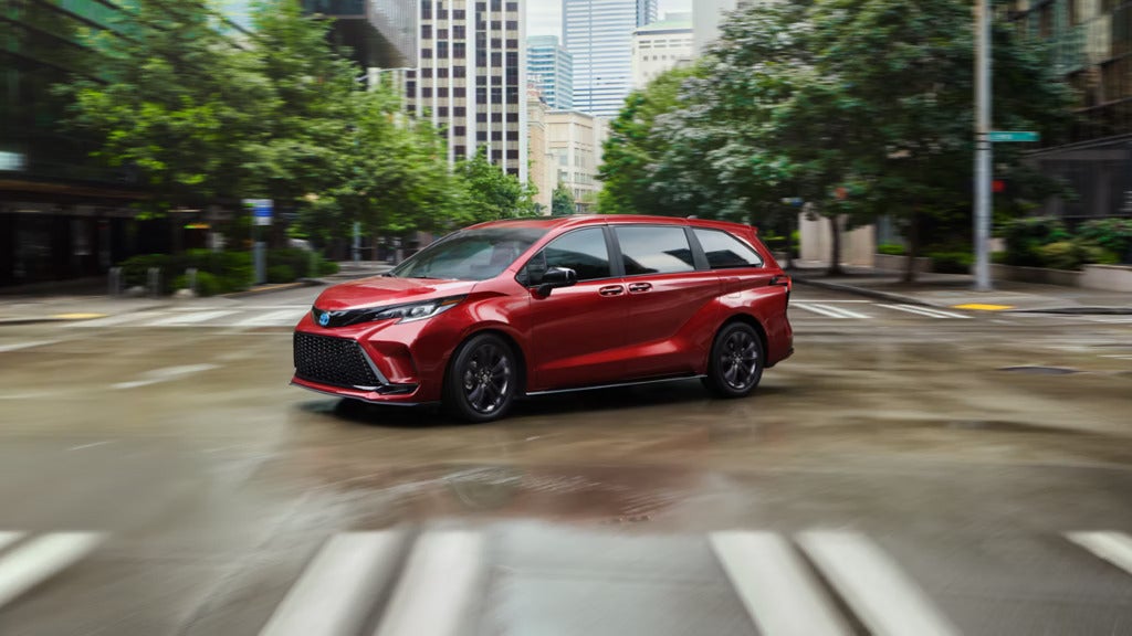 2025 Toyota Sienna taking a turn on the a road