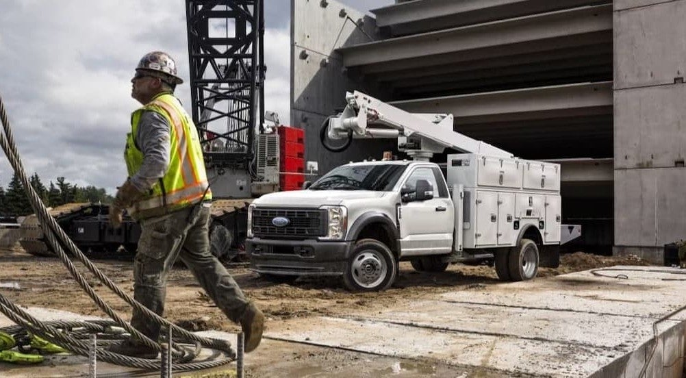 A white 2026 Ford F-550 parked on a job site.