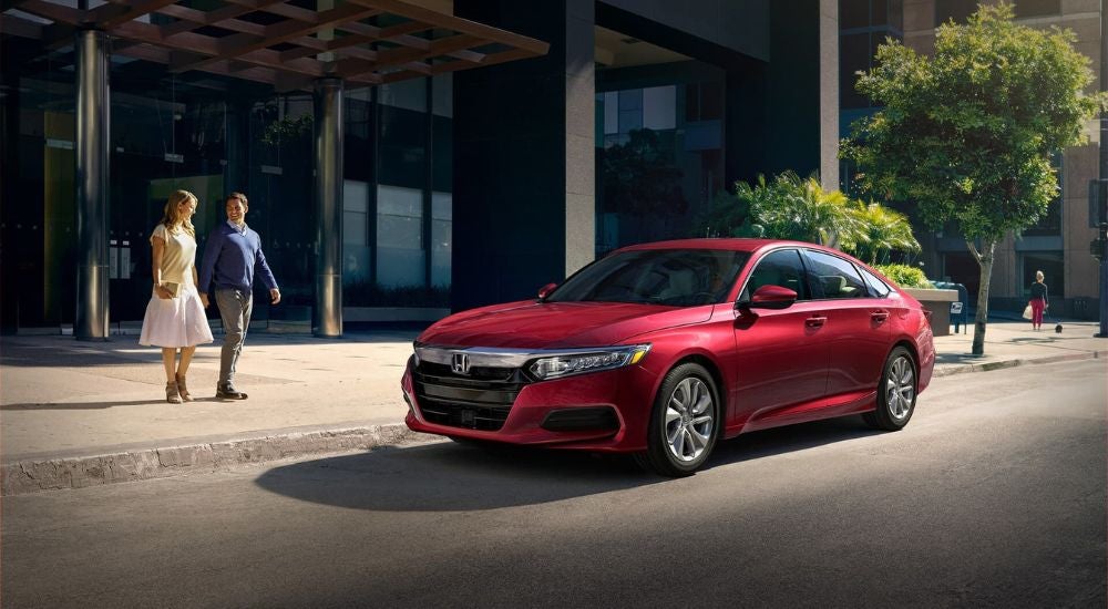 Red 2020 Honda Accord parked by a curb.