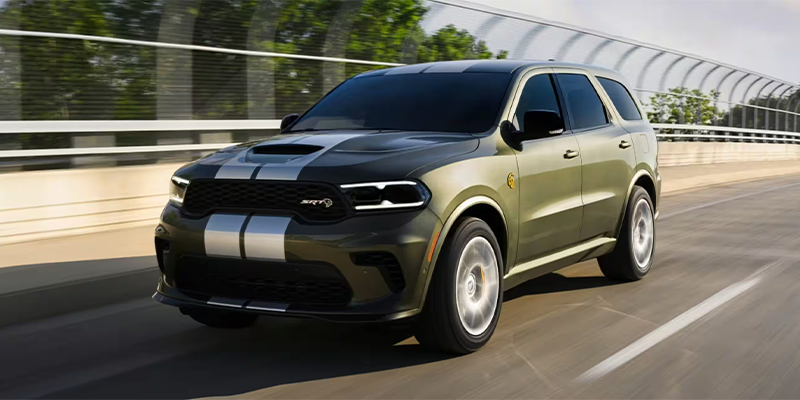 A Dodge Durango SUV driving over a bridge.