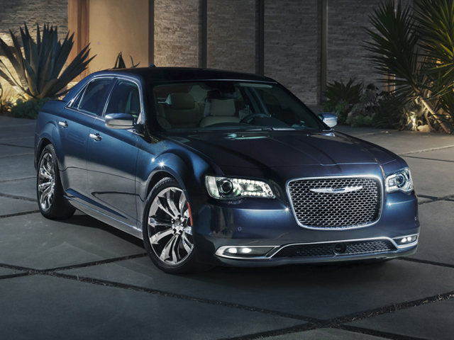 A photo of a gray 2018 Chrysler 300 parked in a driveway