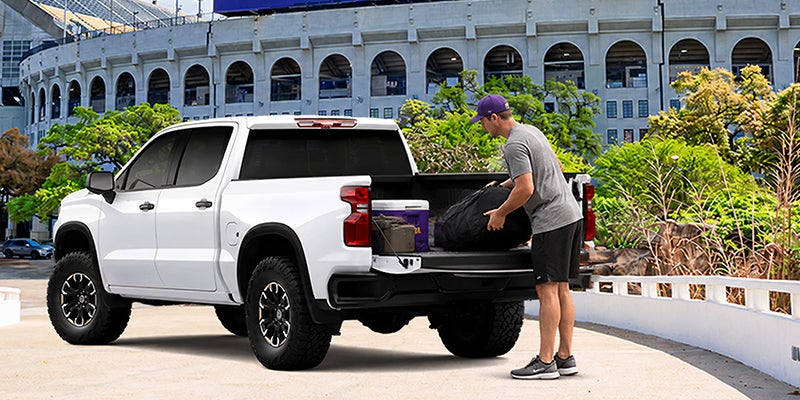 A Chevrolet Silverado 1500 parked in front of LSU's football stadium