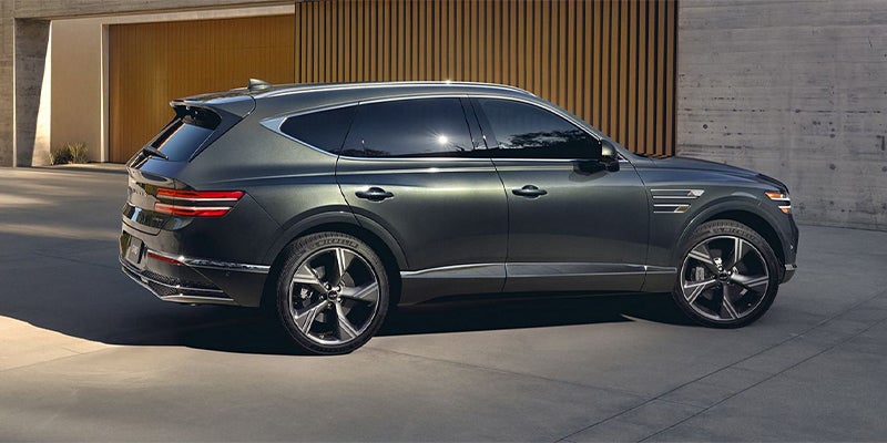 A dark grey Genesis GV80 on display.