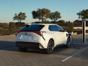 2026 Toyota bZ Electric SUV parked charging up.