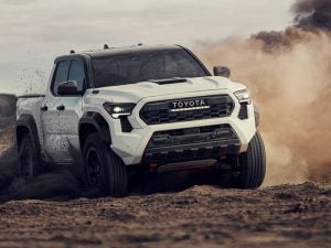 Toyota Tacoma truck driving off-road.