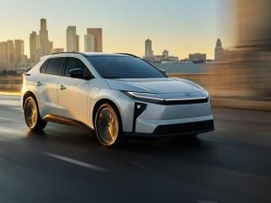 2026 Toyota bZ Electric SUV driving in the city.