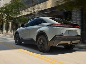 2026 Toyota C-HR driving through town.