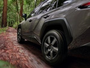 Toyota RAV4 driving in the woods.