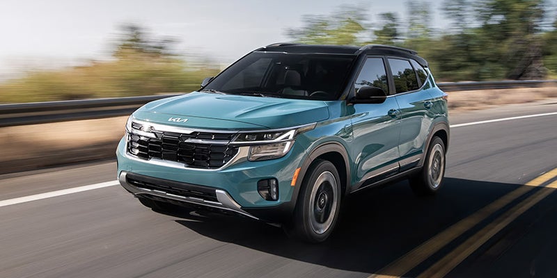 A Kia Seltos compact SUV on the road.