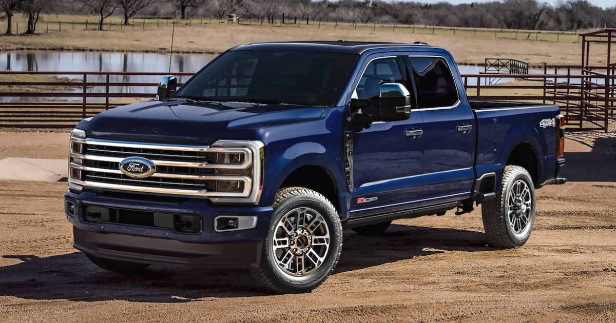 a blue 2026 f250 super duty parked on a ranch