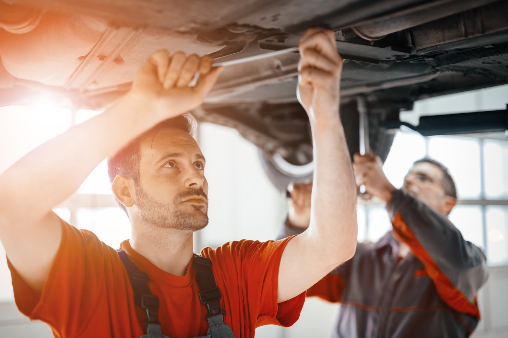 Service Technicians Working on a New Kia