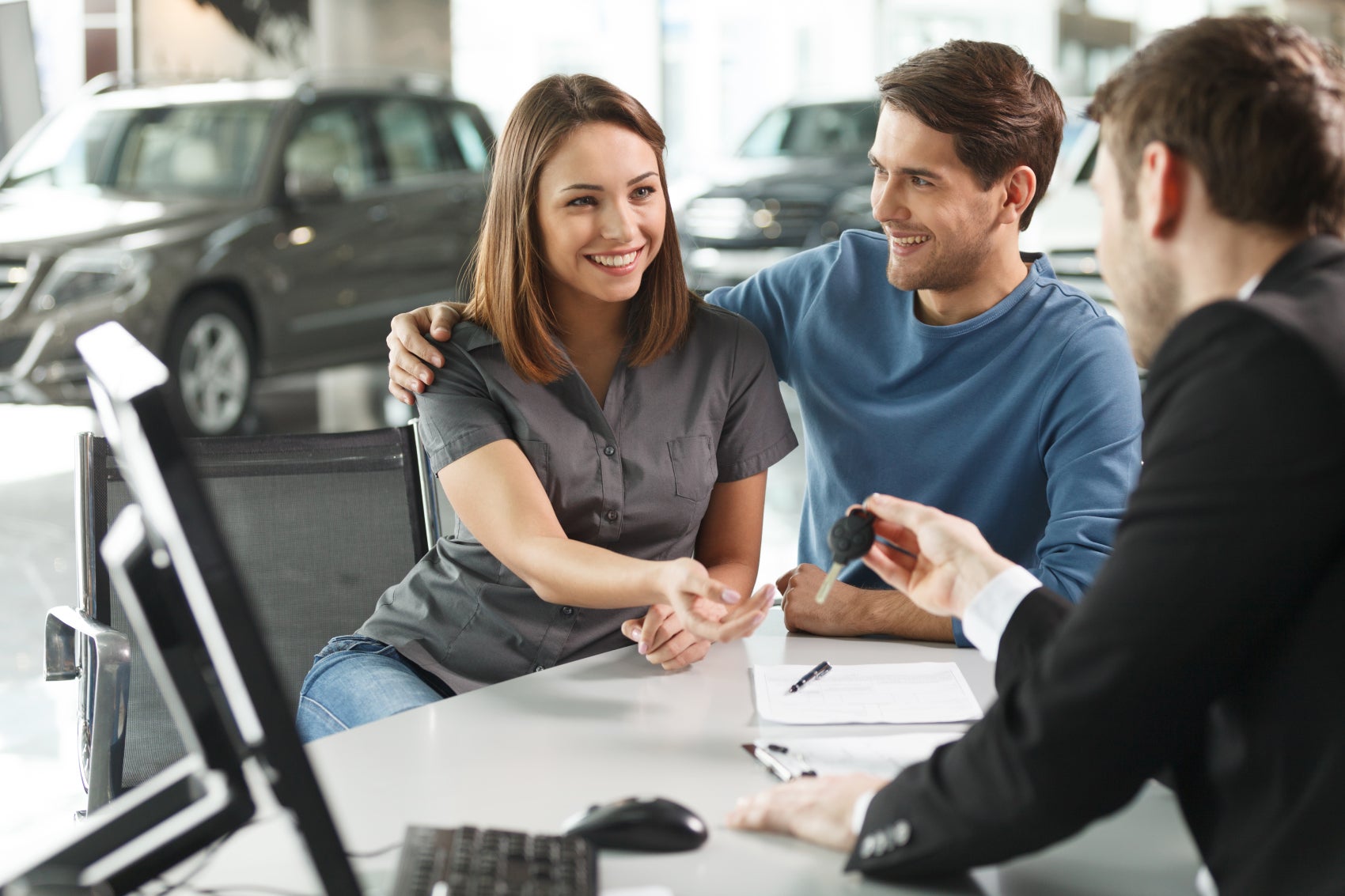 Couple Receiving the Keys to Their New Kia