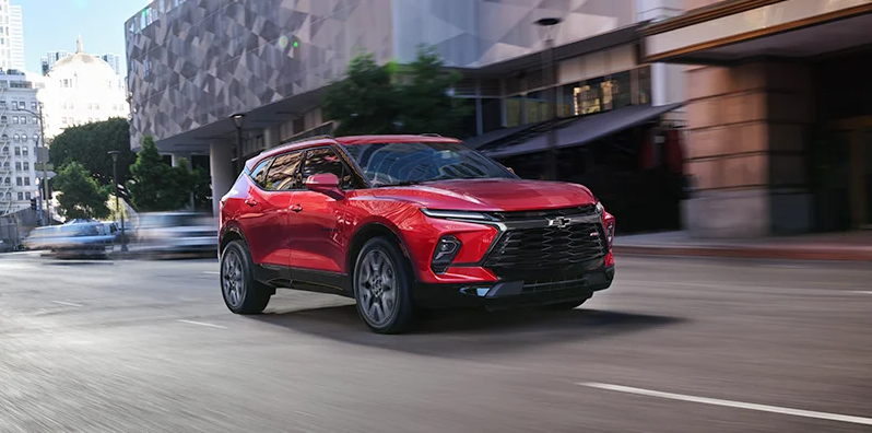 A 2024 Chevrolet Blazer driving down the road near Lawrence, MA.