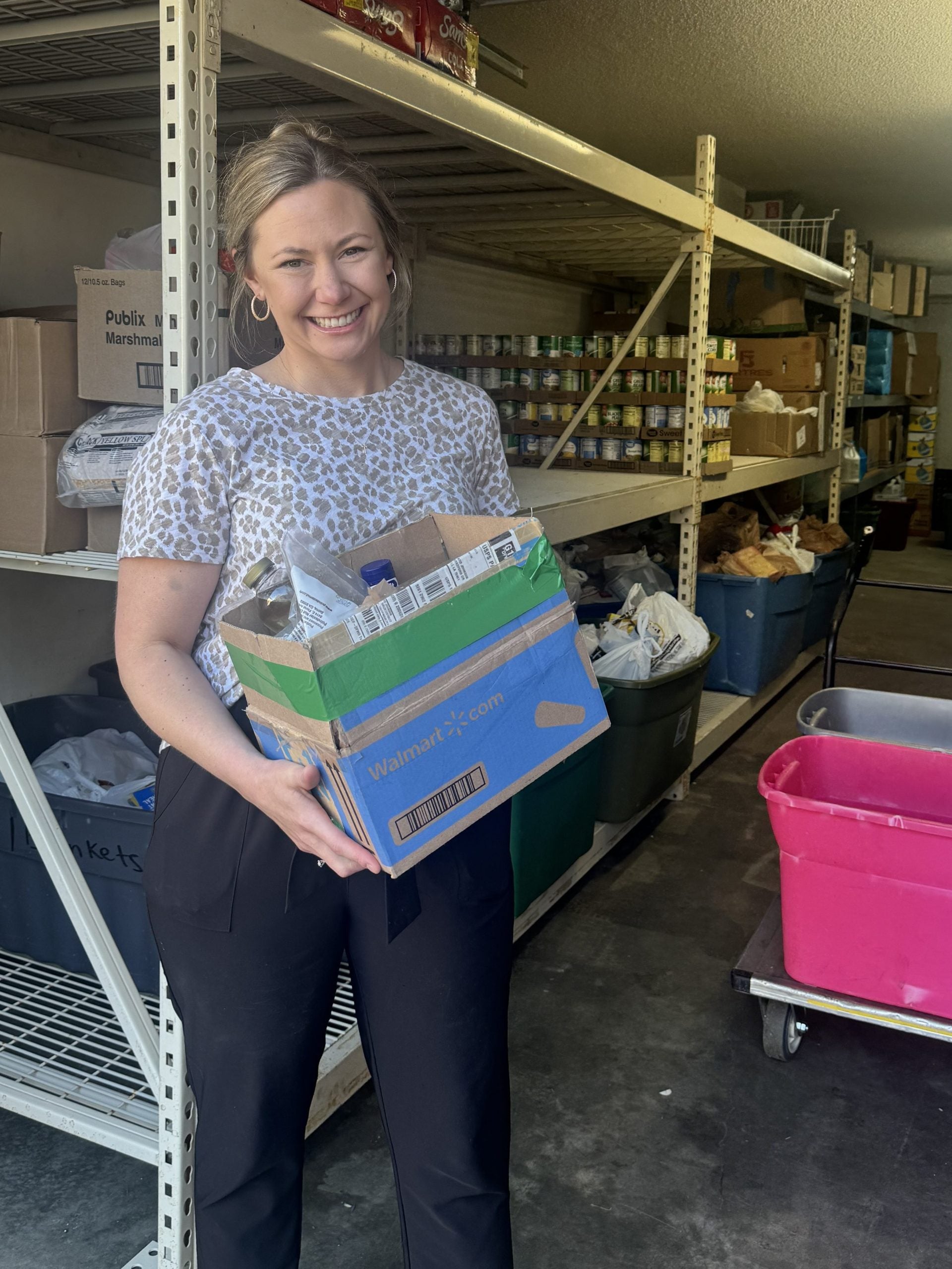 Ali with Mitchell Automotive unloading food drive donations