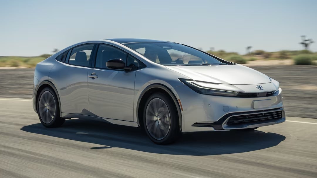 gray 2024 Toyota Prius driving down the street