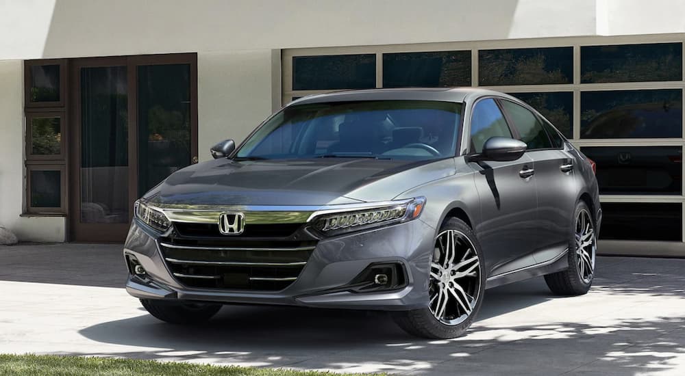 A grey 2021 Honda Accord Touring 2.0T parked in a residential driveway.