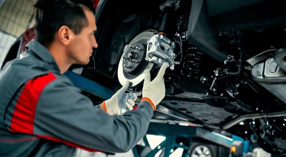 A technician working on brakes.