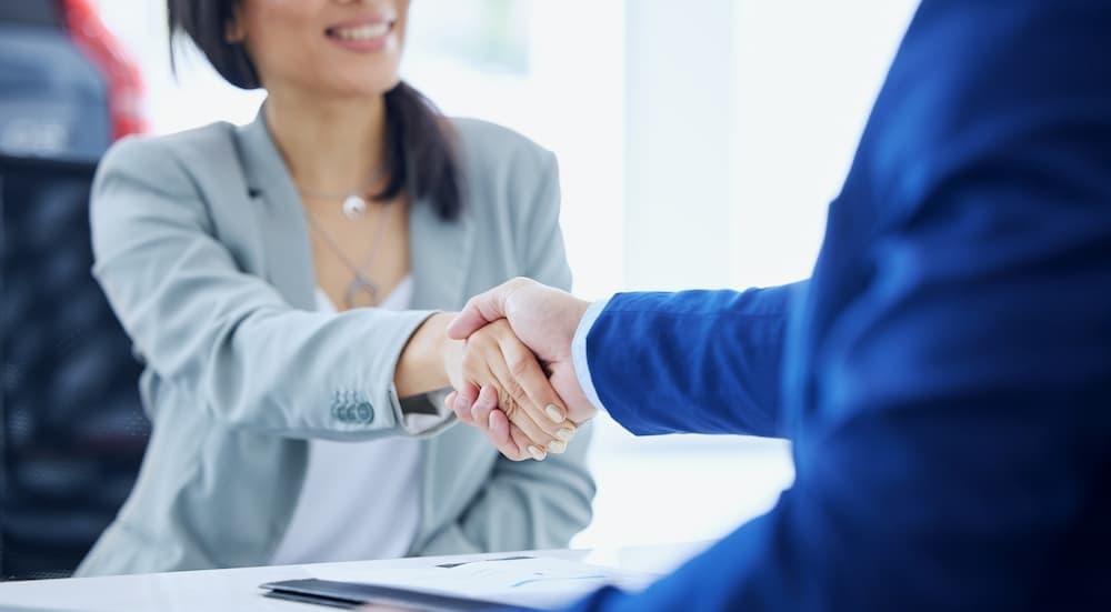 Two people shaking hands.