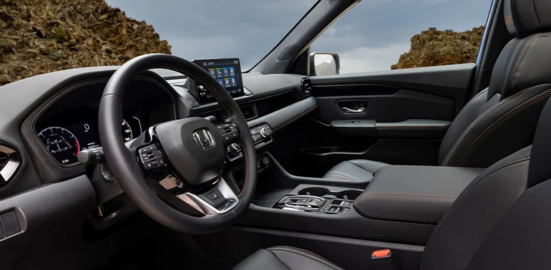 a photo of the center console for the 2025 Honda Pilot.