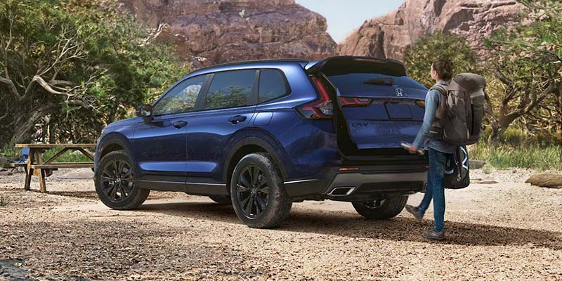 New 2026 Honda CR-V parked in the middle of mountains in it's back profile