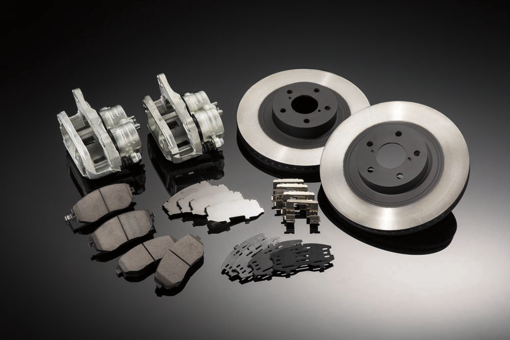 An array of Subaru parts including brake pads and calipers