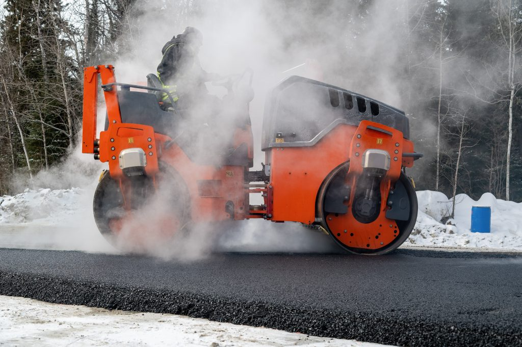 Roller,Compactor,And,Asphalting,In,Winter,On,A,Road